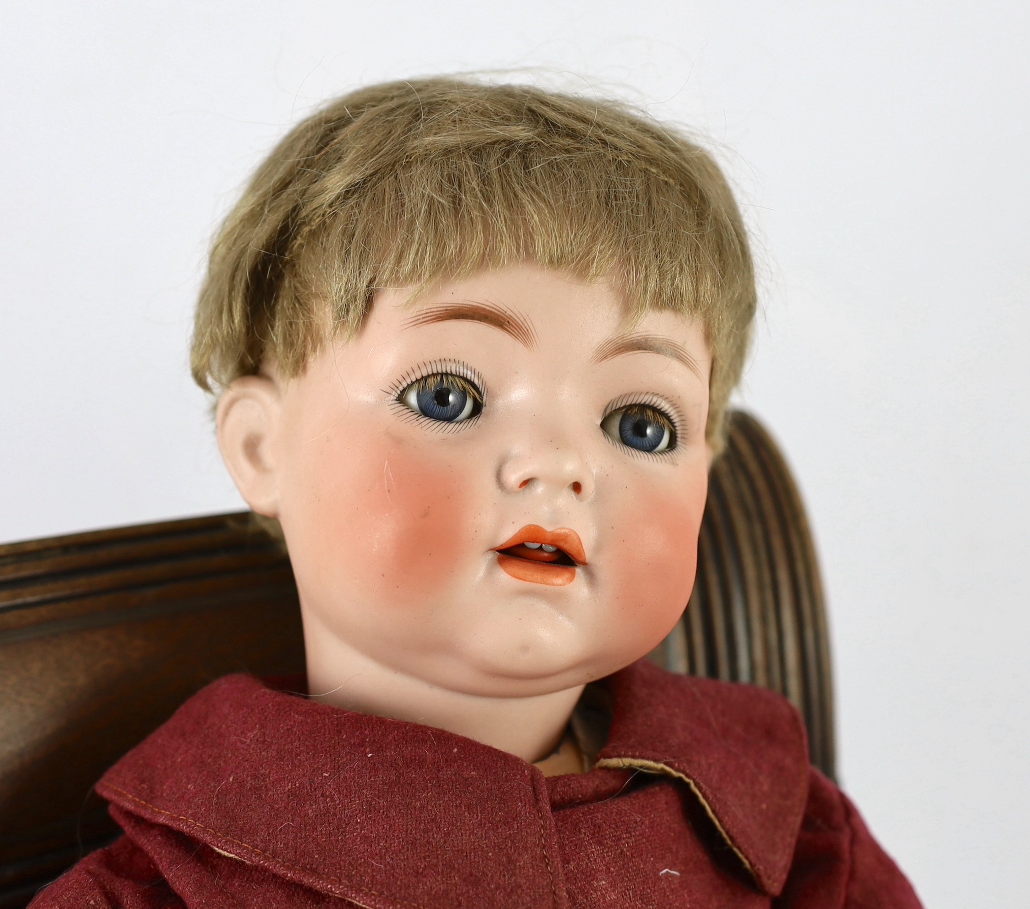 A Kammer & Reinhardt / Simon & Halbig bisque character doll, German, circa 1912, 22in. Please note the chair is for display purposes only.